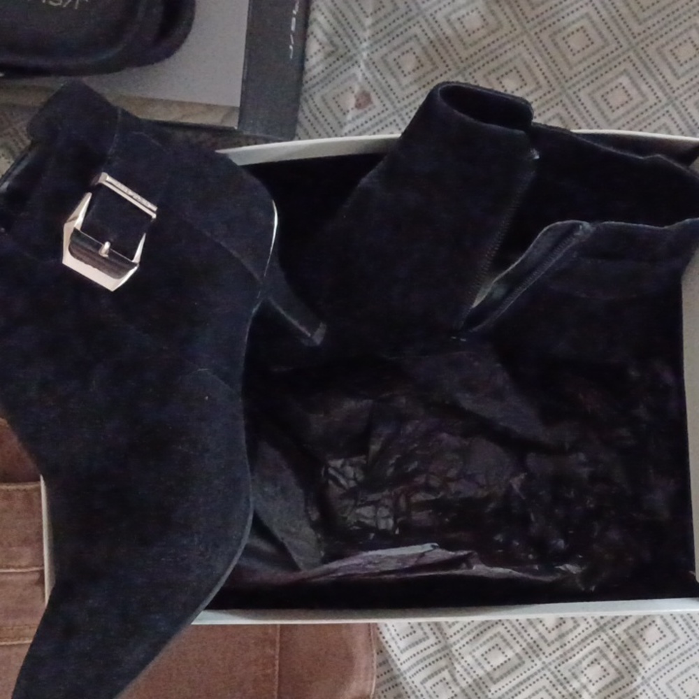 Suede an  klein.half boot heels,size 6 an a half.very worn slightly